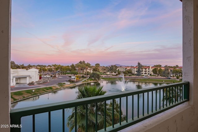 balcony featuring a water view