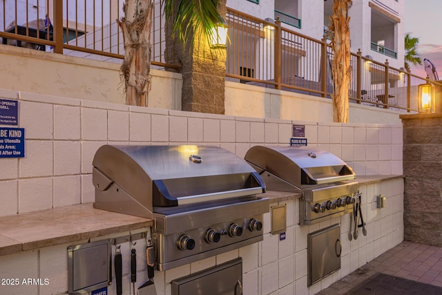 view of patio / terrace with fence and area for grilling