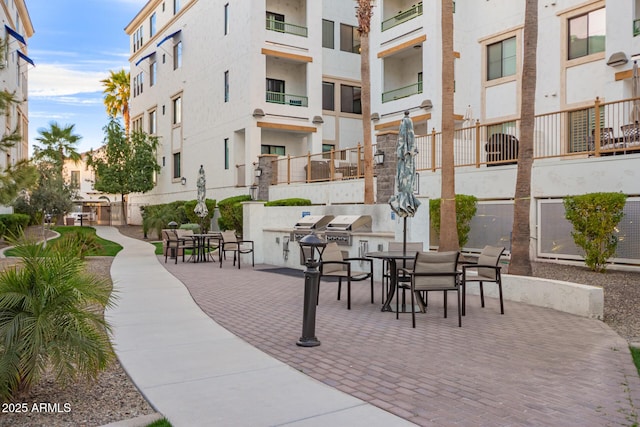 view of property's community with an outdoor kitchen