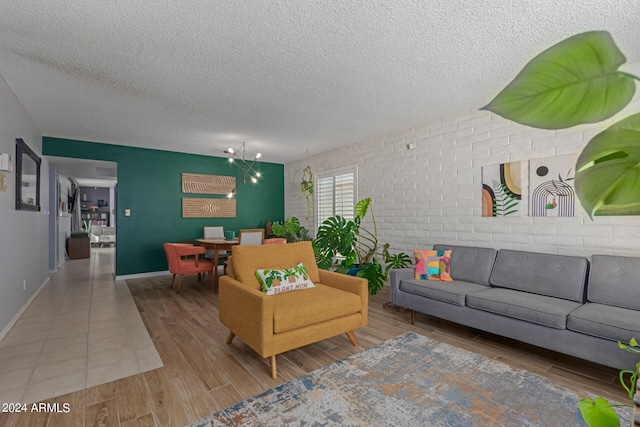 living room with a textured ceiling and hardwood / wood-style floors