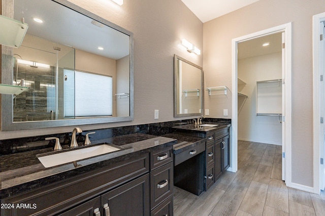 bathroom with vanity and an enclosed shower