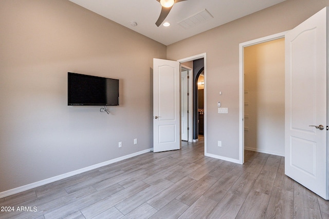 unfurnished bedroom featuring ceiling fan and light hardwood / wood-style floors