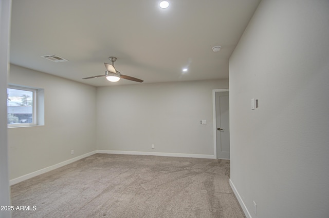 carpeted spare room featuring baseboards, visible vents, a ceiling fan, and recessed lighting