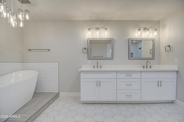 full bath featuring double vanity, a soaking tub, a shower, and a sink