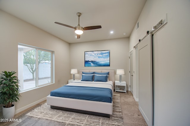 bedroom featuring a ceiling fan, light colored carpet, visible vents, and baseboards