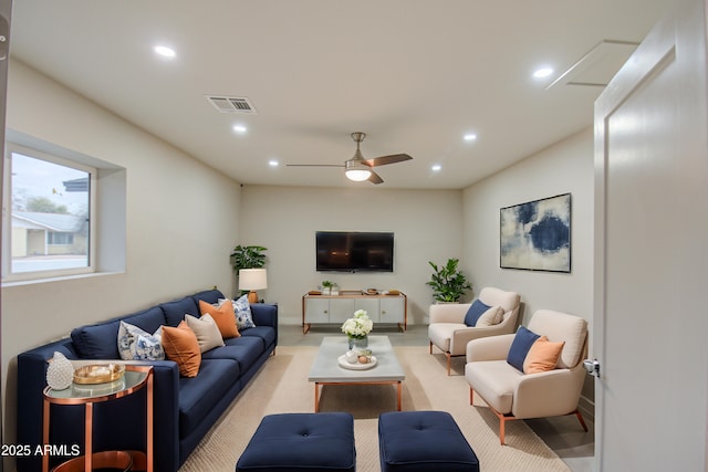 living room with baseboards, a ceiling fan, visible vents, and recessed lighting