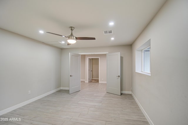 unfurnished bedroom with light wood-style flooring, recessed lighting, a ceiling fan, visible vents, and baseboards