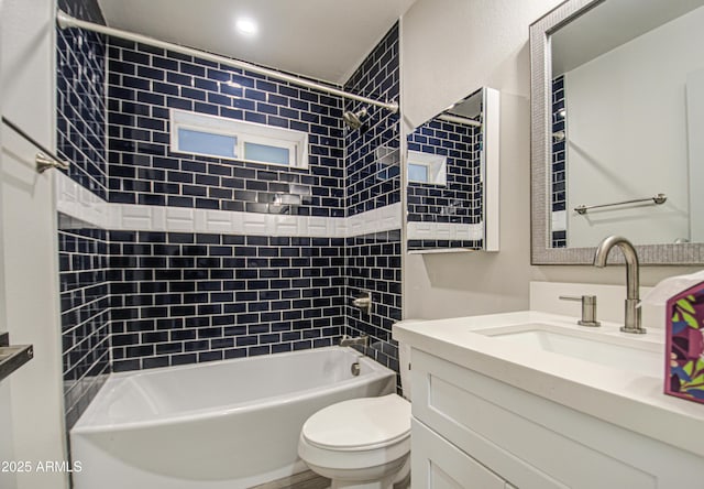 full bathroom featuring  shower combination, vanity, and toilet