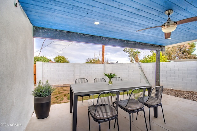 view of patio / terrace featuring ceiling fan, outdoor dining space, and a fenced backyard