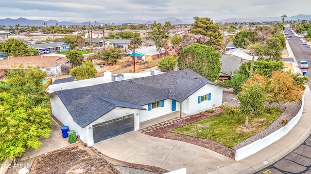 birds eye view of property with a residential view and a mountain view