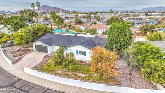 birds eye view of property featuring a mountain view