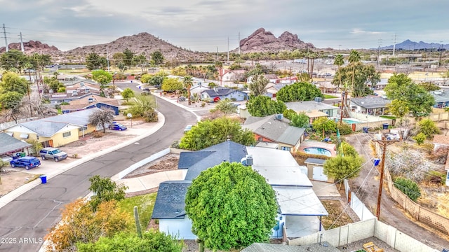 drone / aerial view featuring a residential view and a mountain view