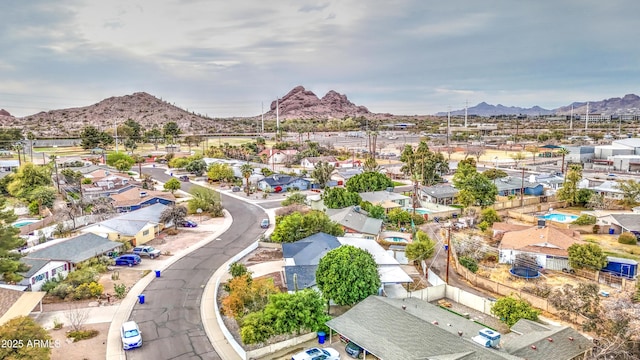 drone / aerial view featuring a residential view and a mountain view