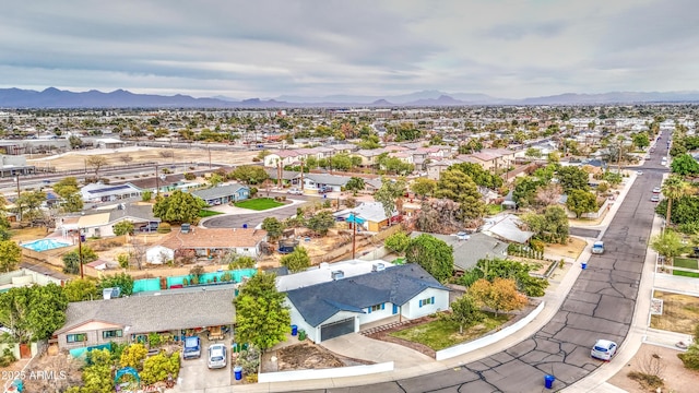 birds eye view of property with a residential view and a mountain view