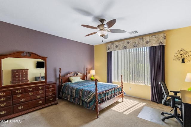 bedroom featuring ceiling fan and light carpet