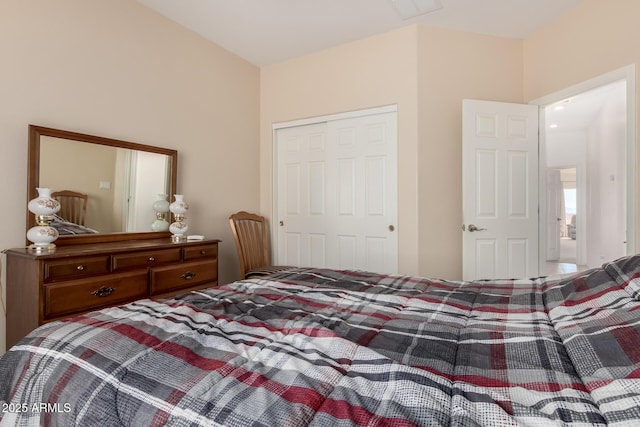 bedroom featuring a closet and visible vents