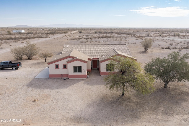 birds eye view of property with a desert view and a mountain view