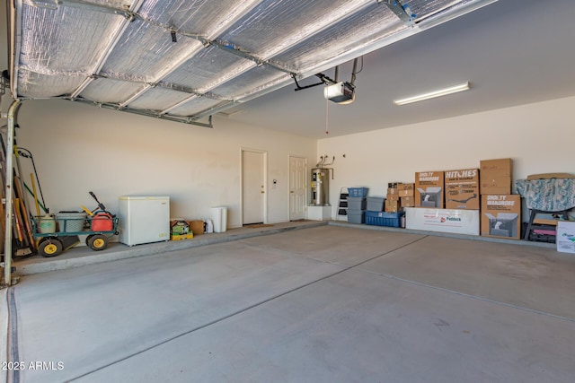 garage with water heater, a garage door opener, and refrigerator