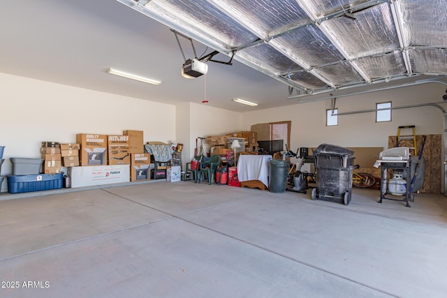 garage featuring a garage door opener