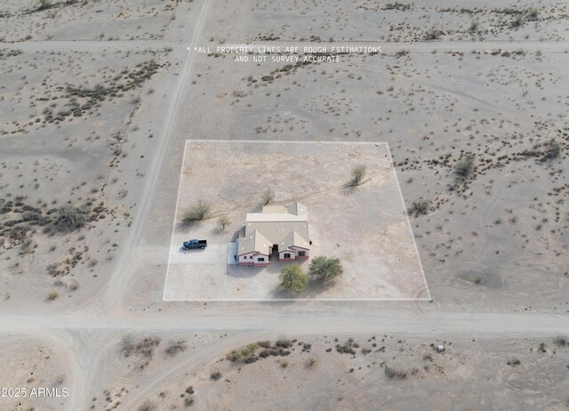 birds eye view of property with view of desert