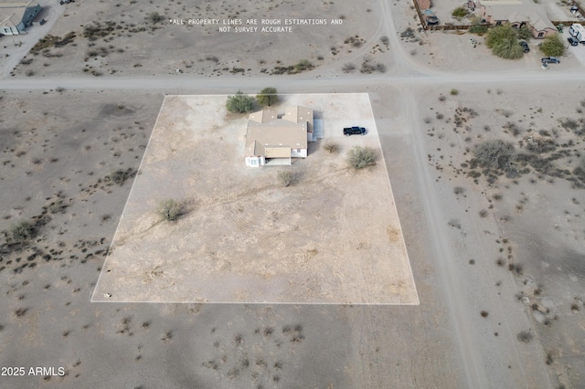 birds eye view of property featuring view of desert