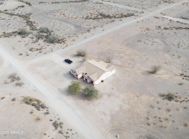 birds eye view of property with view of desert