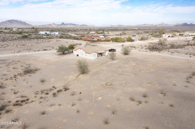 bird's eye view with a mountain view and a desert view