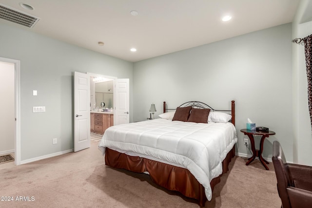 carpeted bedroom with connected bathroom