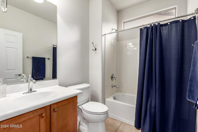 full bathroom featuring tile patterned flooring, vanity, toilet, and shower / bath combo