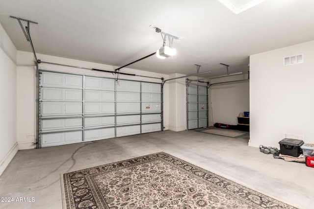 garage featuring a garage door opener