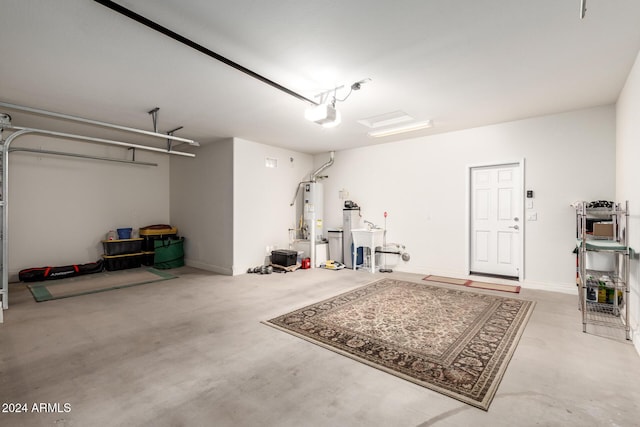 garage featuring a garage door opener and water heater