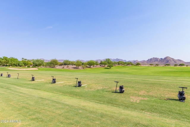 view of property's community featuring a mountain view and a lawn