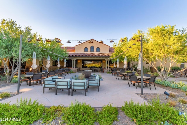 view of community featuring outdoor lounge area and a patio