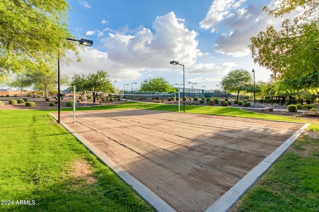 surrounding community featuring volleyball court and a yard