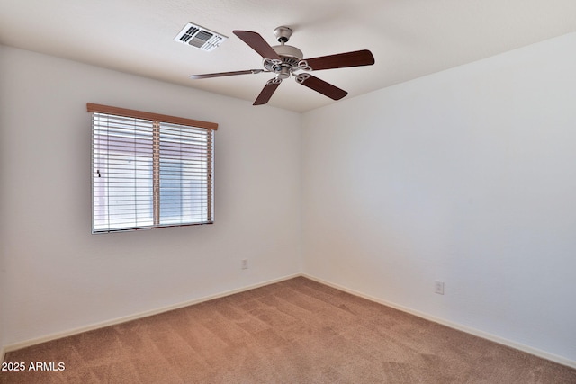 19002 N Toledo Ave, Maricopa, AZ 85138 - empty room with baseboards, visible vents, a ceiling fan, and light colored carpet