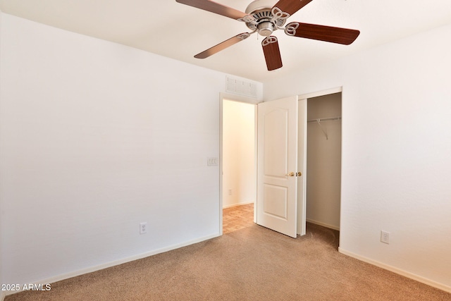 19002 N Toledo Ave, Maricopa, AZ 85138 - unfurnished bedroom with visible vents, a ceiling fan, a closet, baseboards, and light colored carpet