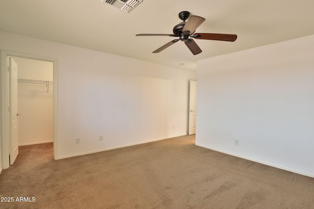 19002 N Toledo Ave, Maricopa, AZ 85138 - unfurnished bedroom with baseboards, a spacious closet, visible vents, carpet, and a closet
