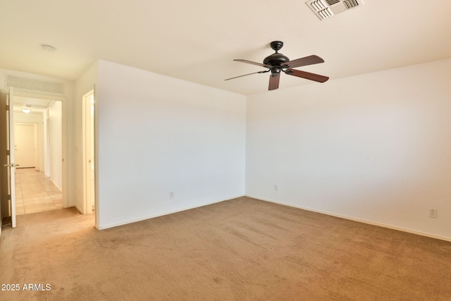 19002 N Toledo Ave, Maricopa, AZ 85138 - spare room featuring ceiling fan, light carpet, visible vents, and baseboards