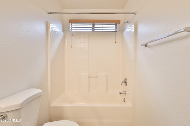 19002 N Toledo Ave, Maricopa, AZ 85138 - bathroom with a textured wall, toilet, and shower / washtub combination