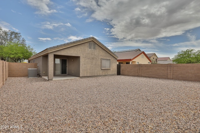 19002 N Toledo Ave, Maricopa, AZ 85138 - rear view of house featuring stucco siding, a patio, a fenced backyard, and central AC unit
