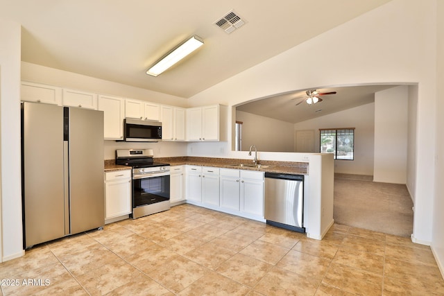 19002 N Toledo Ave, Maricopa, AZ 85138 - kitchen featuring vaulted ceiling, a ceiling fan, a sink, stainless steel appliances, and visible vents