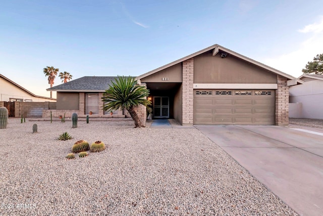 ranch-style home with a garage