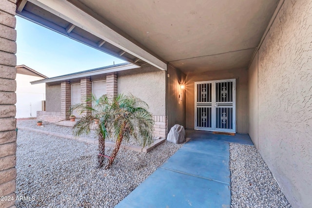 doorway to property featuring a patio area