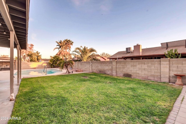 view of yard featuring a fenced in pool