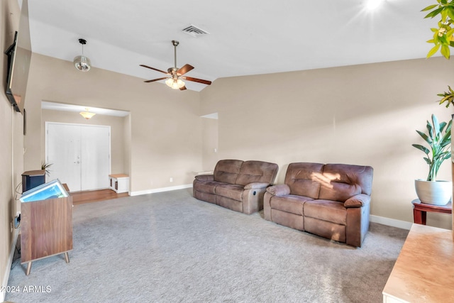 carpeted living room with vaulted ceiling and ceiling fan