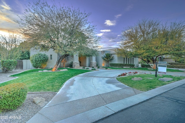 obstructed view of property featuring a lawn