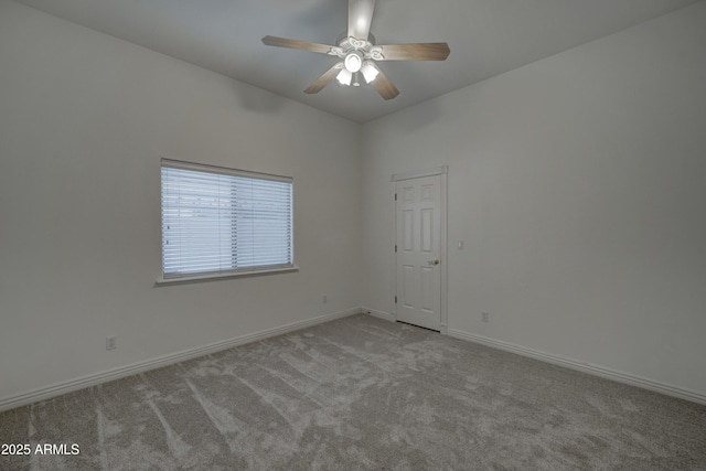 carpeted empty room featuring ceiling fan