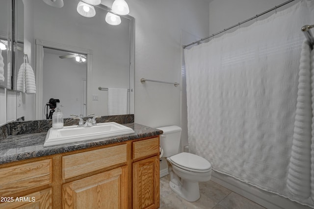 bathroom with vanity, tile patterned floors, and toilet