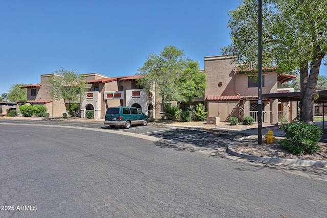 5757 W Eugie Ave Unit 2068, Glendale, AZ 85304 - view of building exterior featuring uncovered parking