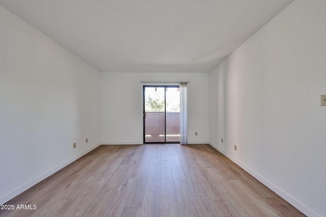 5757 W Eugie Ave Unit 2068, Glendale, AZ 85304 - unfurnished room with wood finished floors, baseboards, and a textured ceiling